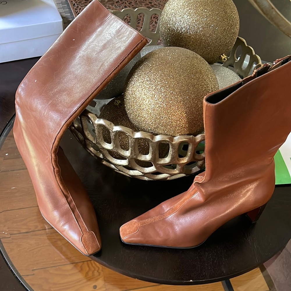 Mid calf, worn twice sitting so long in box small dot on boot. Awesome condition